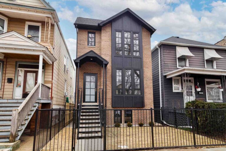 black house with wood trim